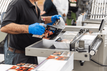 Print technician working on an automated digital press 