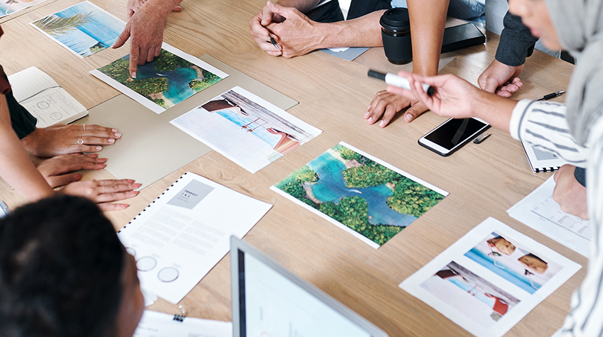 Print travel marketing materials on a table
