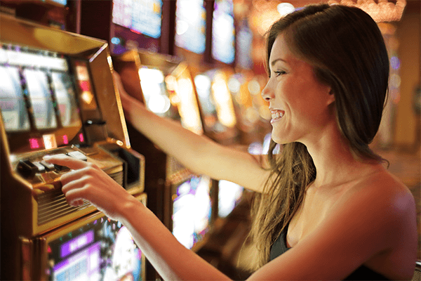 A person playing a slot machine