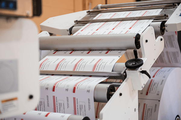 A roll of paper fed through a printer