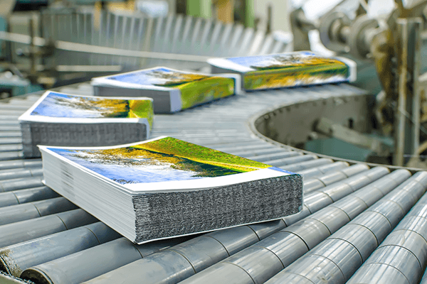 Stacks of mail on a conveyor