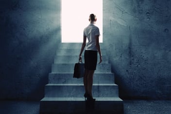 Man with briefcase standing on stairs