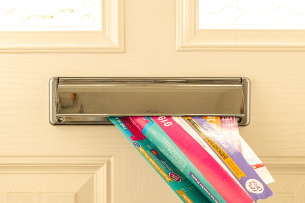Letters being inserted into a mail slot 