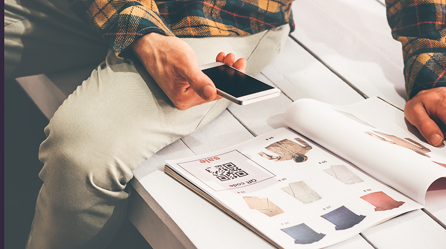 Recipient of a print catalog using a QR code in the catalog